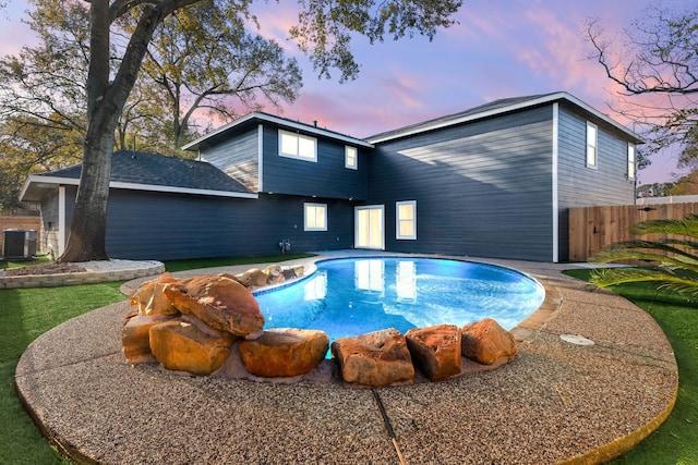 pool at dusk with cooling unit