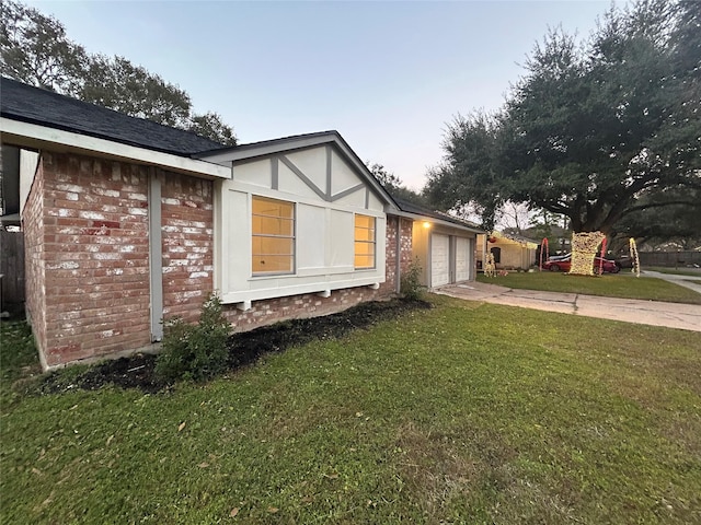 view of property exterior featuring a yard and a garage