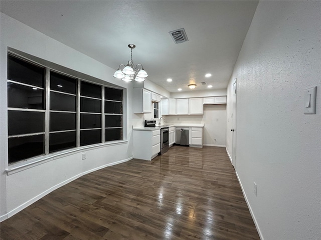 kitchen featuring pendant lighting, white cabinetry, stainless steel appliances, a notable chandelier, and dark hardwood / wood-style flooring