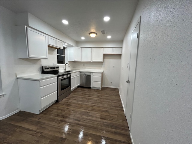 kitchen with white cabinetry, sink, dark hardwood / wood-style floors, and appliances with stainless steel finishes