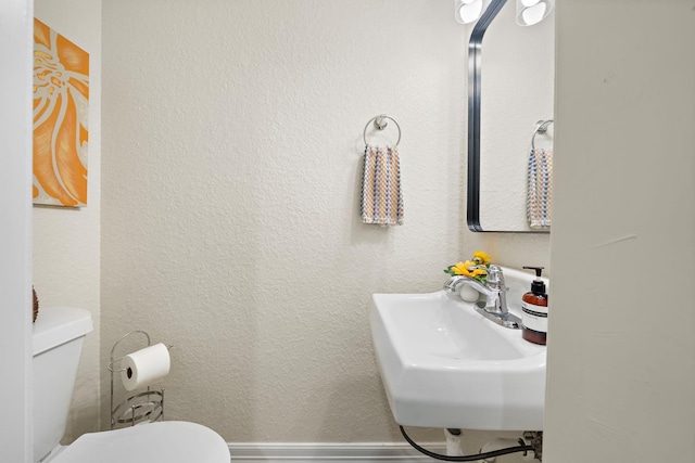 bathroom with sink and toilet