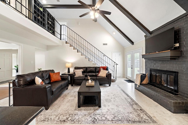 living room with beamed ceiling, ceiling fan, french doors, a brick fireplace, and high vaulted ceiling