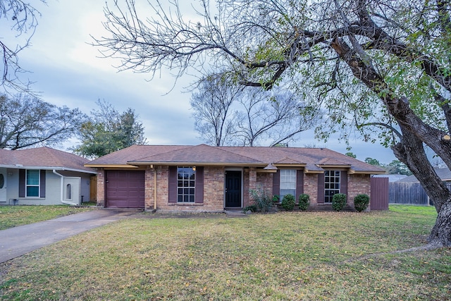 single story home featuring a front yard and a garage