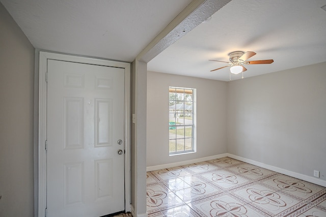 interior space featuring ceiling fan