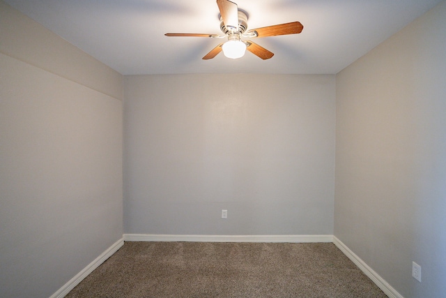 empty room with ceiling fan and carpet flooring