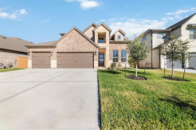 view of front of home featuring a front lawn and a garage