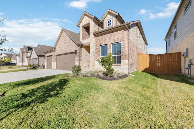 view of front of home featuring a front yard and a garage