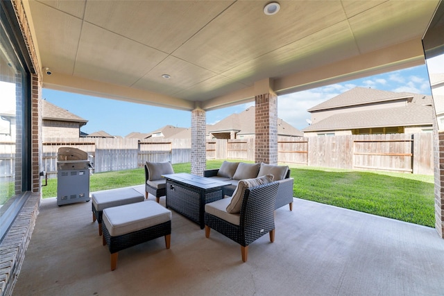 view of patio with outdoor lounge area and a grill