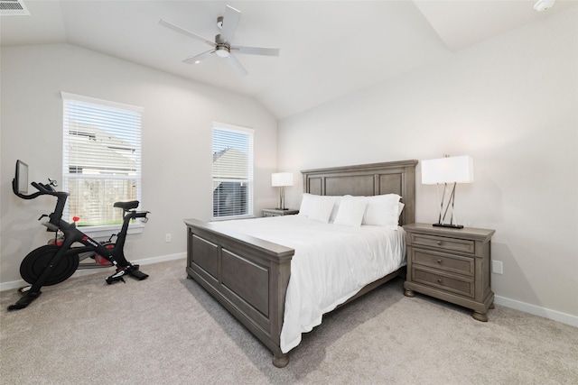 carpeted bedroom featuring ceiling fan and vaulted ceiling