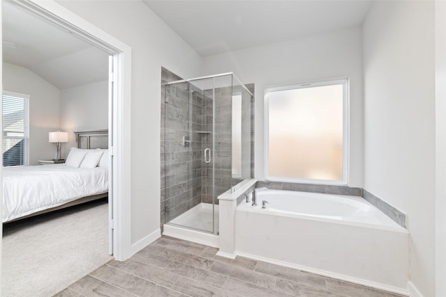 bathroom featuring separate shower and tub