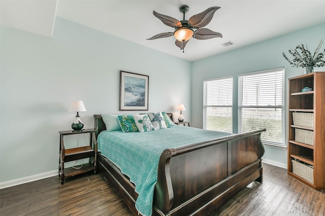 bedroom with ceiling fan and dark wood-type flooring