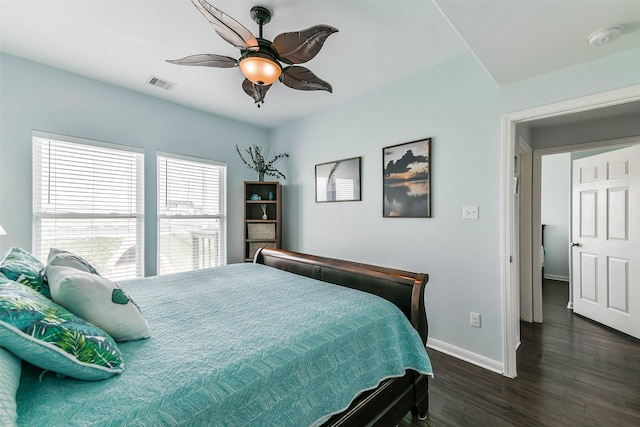 bedroom featuring ceiling fan and dark hardwood / wood-style floors