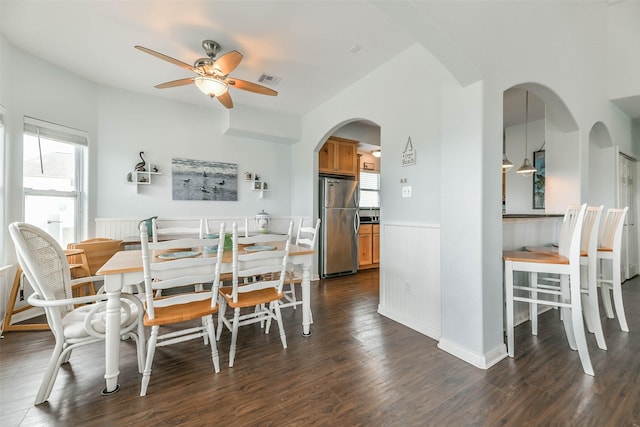 dining room with ceiling fan and dark hardwood / wood-style floors