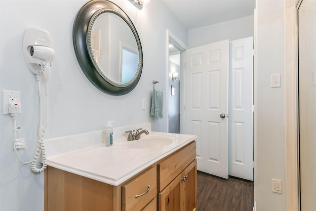 bathroom with vanity and hardwood / wood-style flooring