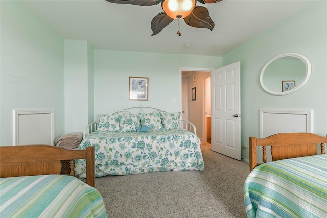 bedroom with ceiling fan and carpet