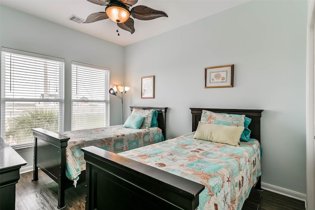 bedroom featuring dark hardwood / wood-style flooring and ceiling fan