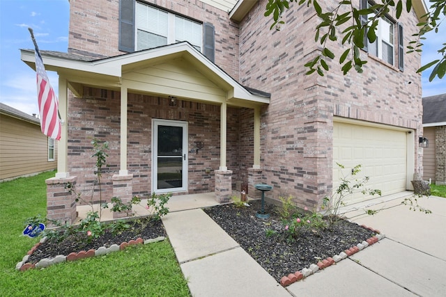 property entrance with a garage and covered porch