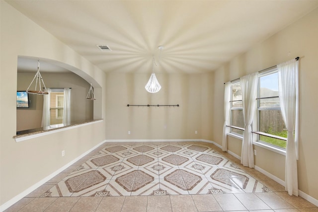 spare room with light tile patterned floors