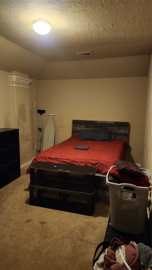 carpeted bedroom featuring pool table, lofted ceiling, and a textured ceiling