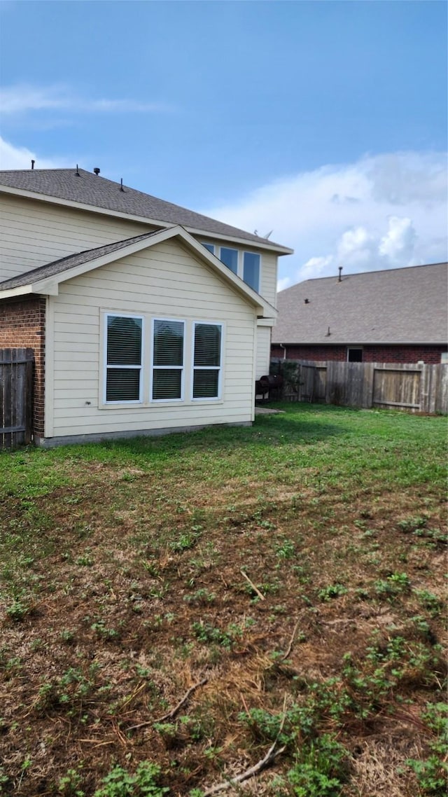 view of property exterior with a lawn