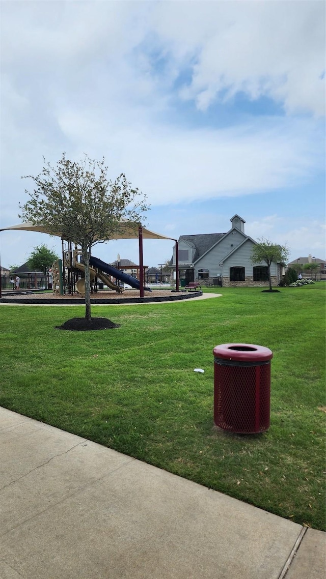 view of yard with central AC and a playground