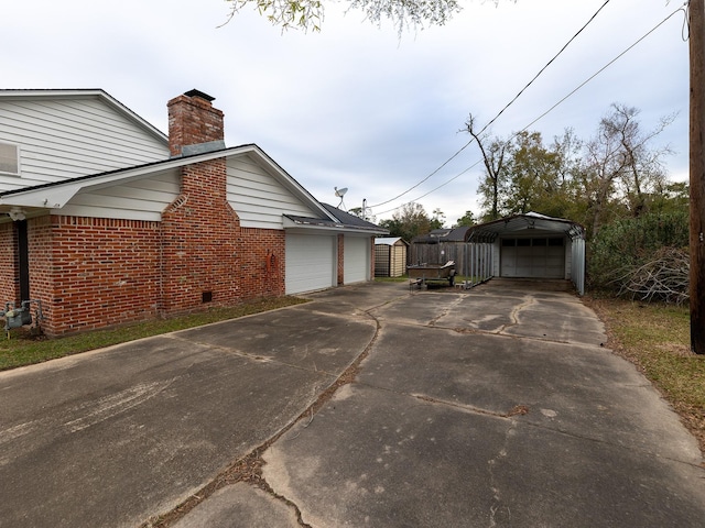 view of property exterior featuring a carport and a garage