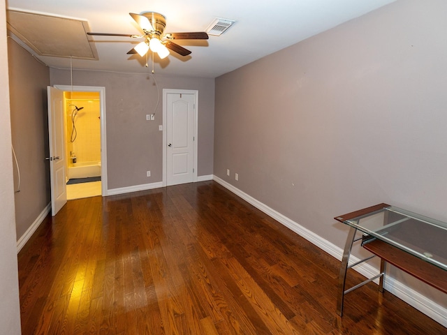 unfurnished bedroom featuring ceiling fan and dark hardwood / wood-style floors