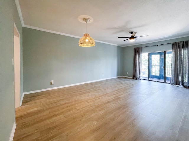 spare room with ceiling fan, light hardwood / wood-style floors, and crown molding