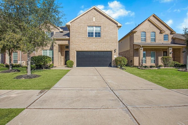 view of front facade featuring a front yard and a garage