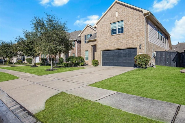 view of property with a front yard and a garage