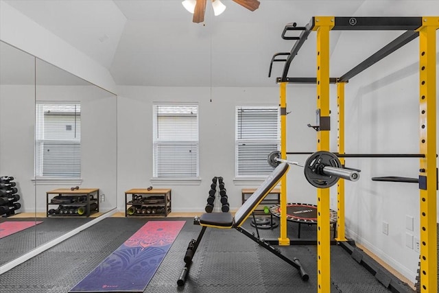 workout area with ceiling fan and vaulted ceiling