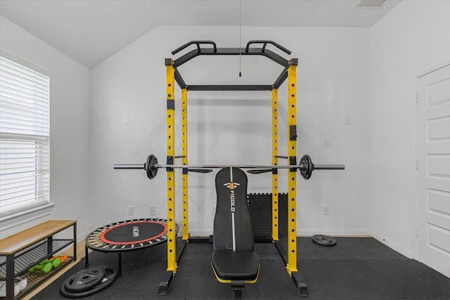 exercise area with lofted ceiling and a wealth of natural light