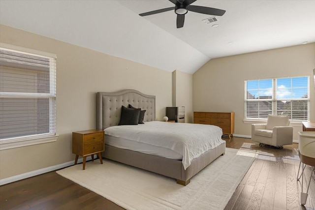 bedroom with vaulted ceiling, ceiling fan, and hardwood / wood-style floors