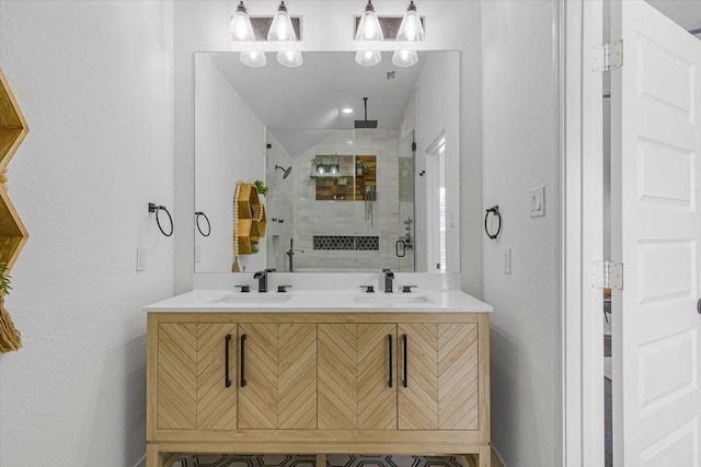 bathroom featuring an enclosed shower and vanity