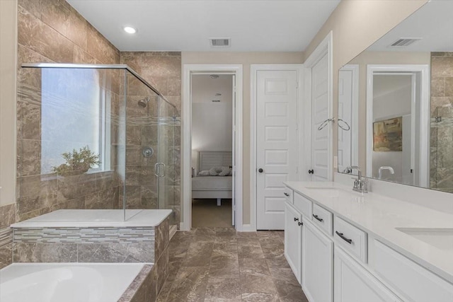 bathroom with vanity and separate shower and tub