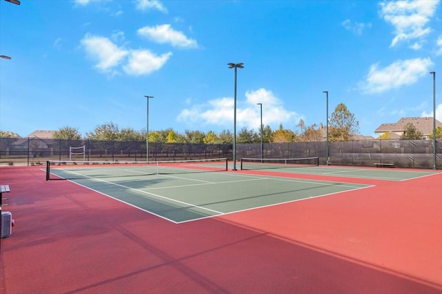 view of sport court featuring basketball hoop