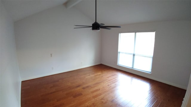 unfurnished room featuring ceiling fan, lofted ceiling with beams, and dark hardwood / wood-style flooring