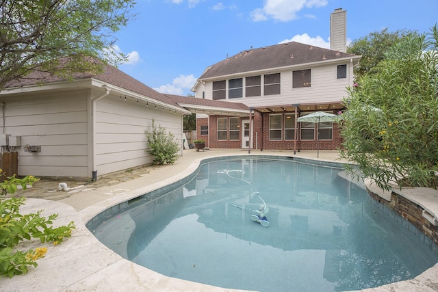 view of swimming pool featuring a patio area