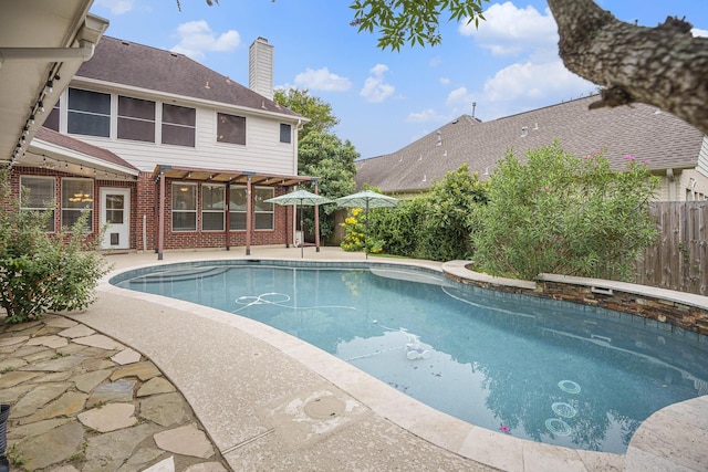 view of swimming pool with a patio