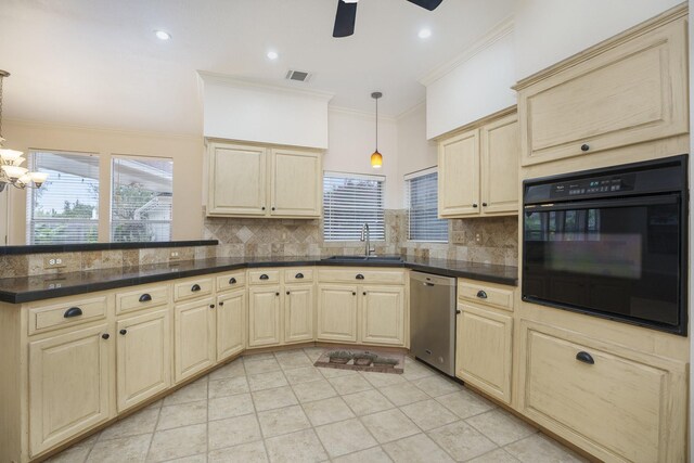 kitchen featuring hanging light fixtures, sink, oven, stainless steel dishwasher, and backsplash