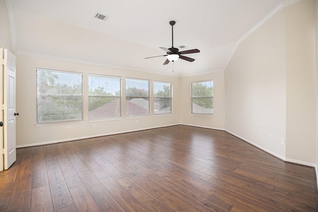 spare room featuring lofted ceiling, ceiling fan, ornamental molding, and dark hardwood / wood-style floors