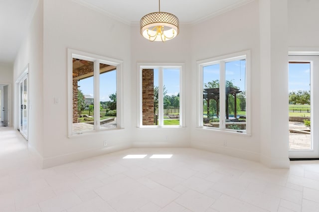 empty room with a healthy amount of sunlight and crown molding