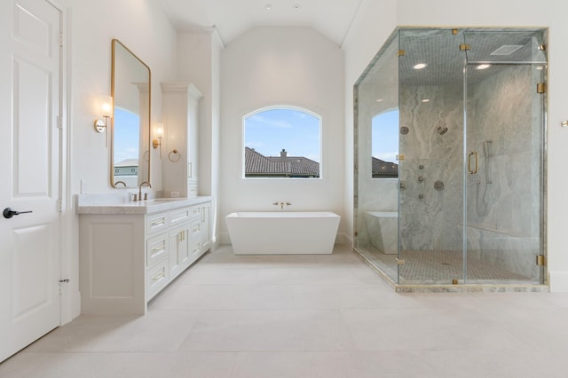 bathroom with high vaulted ceiling, vanity, tile patterned floors, and independent shower and bath