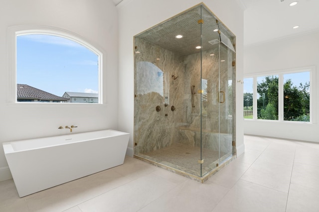 bathroom with separate shower and tub, tile patterned flooring, and crown molding