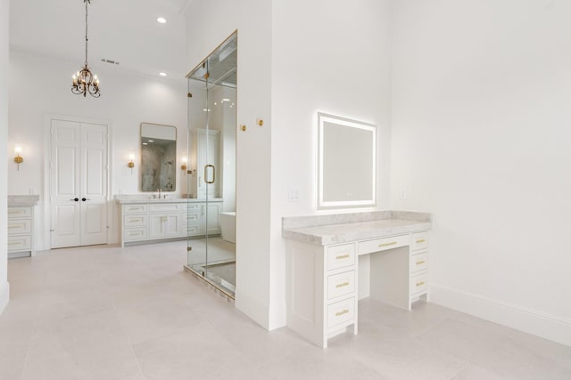 bathroom with a high ceiling, tile patterned flooring, an inviting chandelier, and independent shower and bath