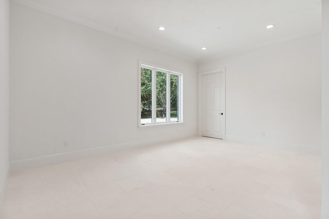 spare room featuring ornamental molding