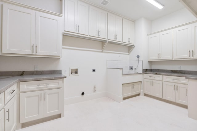 laundry area with electric dryer hookup, cabinets, gas dryer hookup, and washer hookup