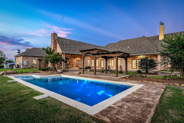 pool at dusk featuring a lawn, a patio area, and a pergola