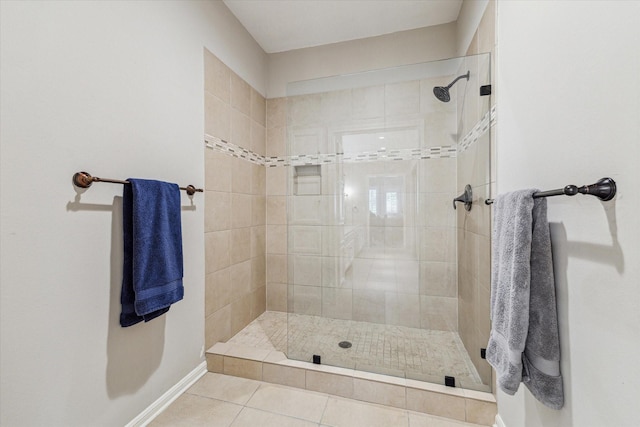 bathroom featuring a tile shower and tile patterned floors