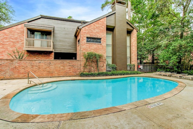 view of pool featuring a patio